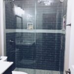 glass shower with blue tile