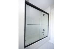 glass shower door with towel bar