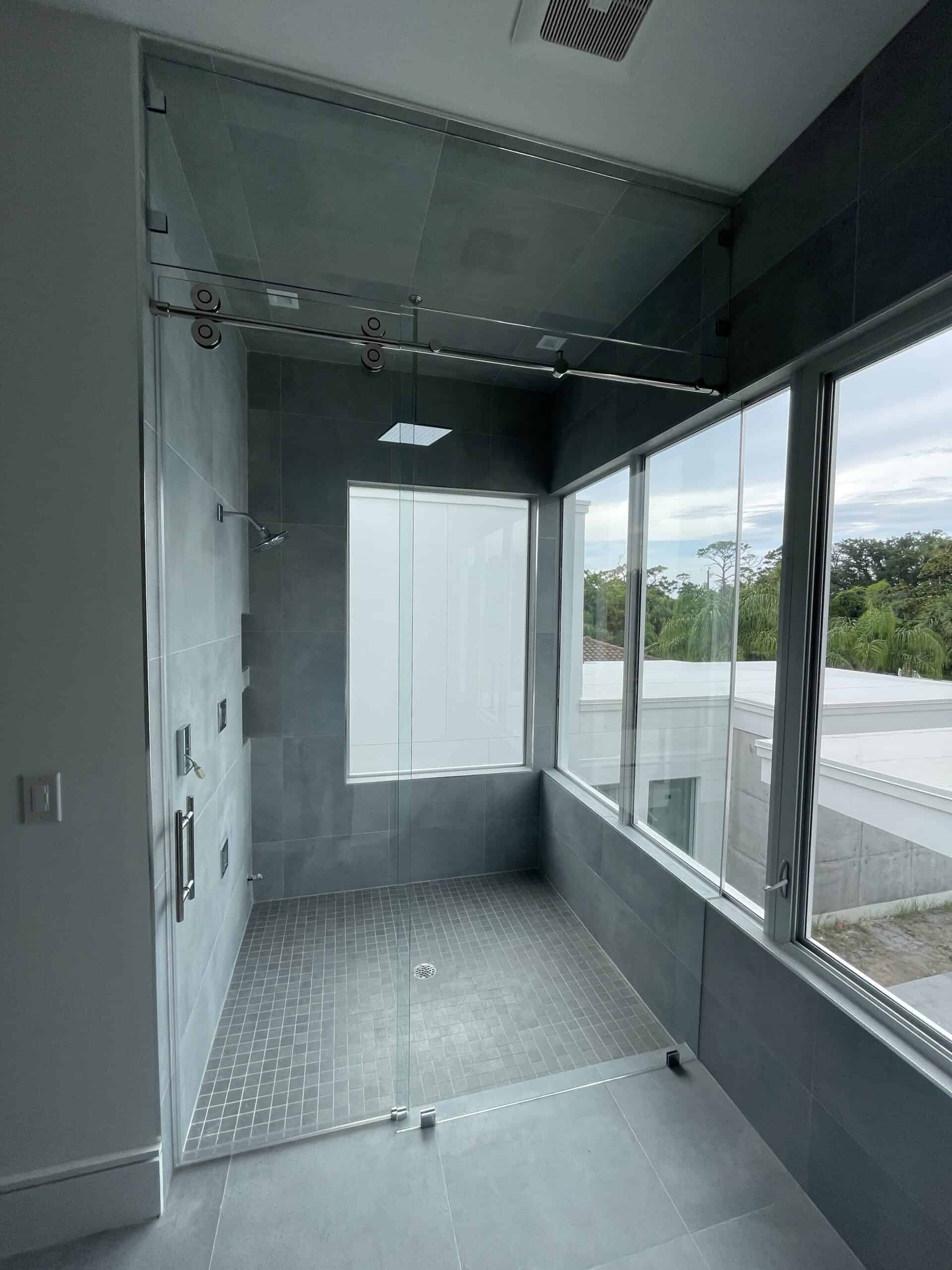 Full view of custom Cascade Series shower door in luxury bathroom from Aldora