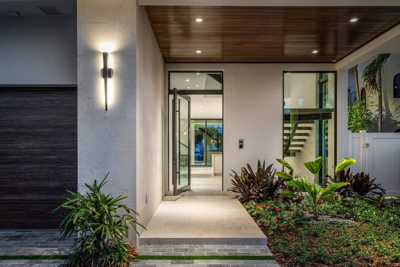 Exterior view of luxury home with pivot entrance door