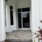 White powder coating pivot door in residential home