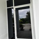 Close up of white powder coating pivot door in residential home