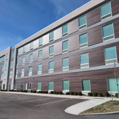 four-storey commercial building with individual windows